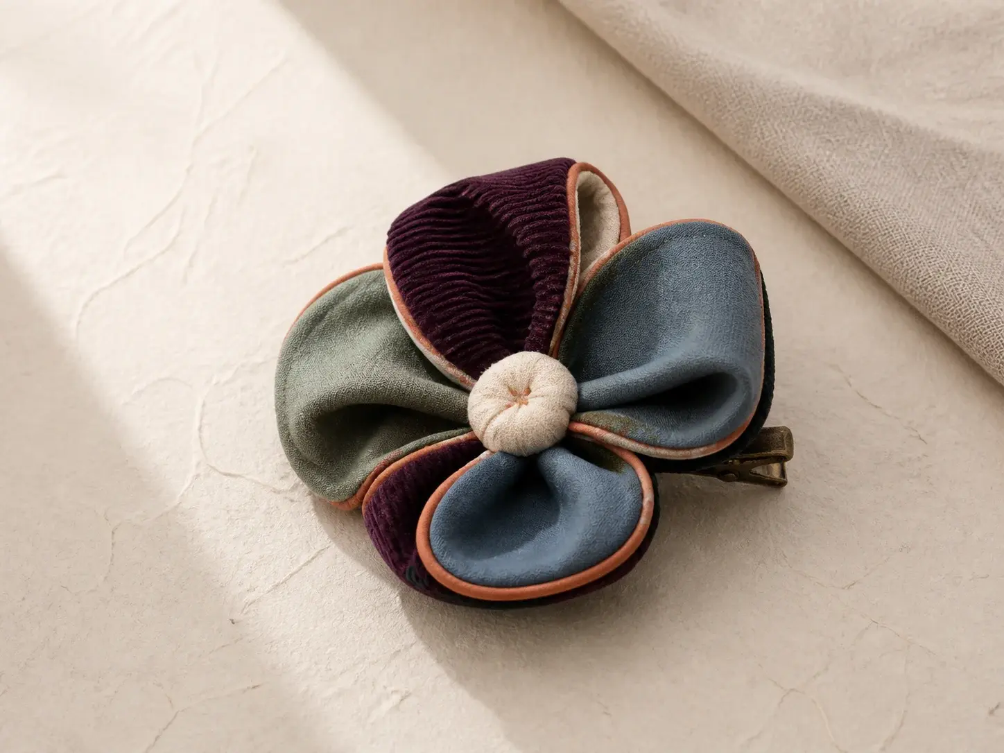 Concept abstract textile bloom clip with folded fabric loops